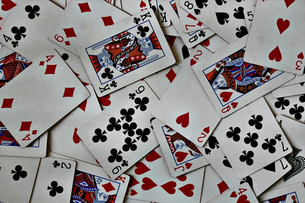 A close-up of playing cards arranged for a game of Gin Rummy